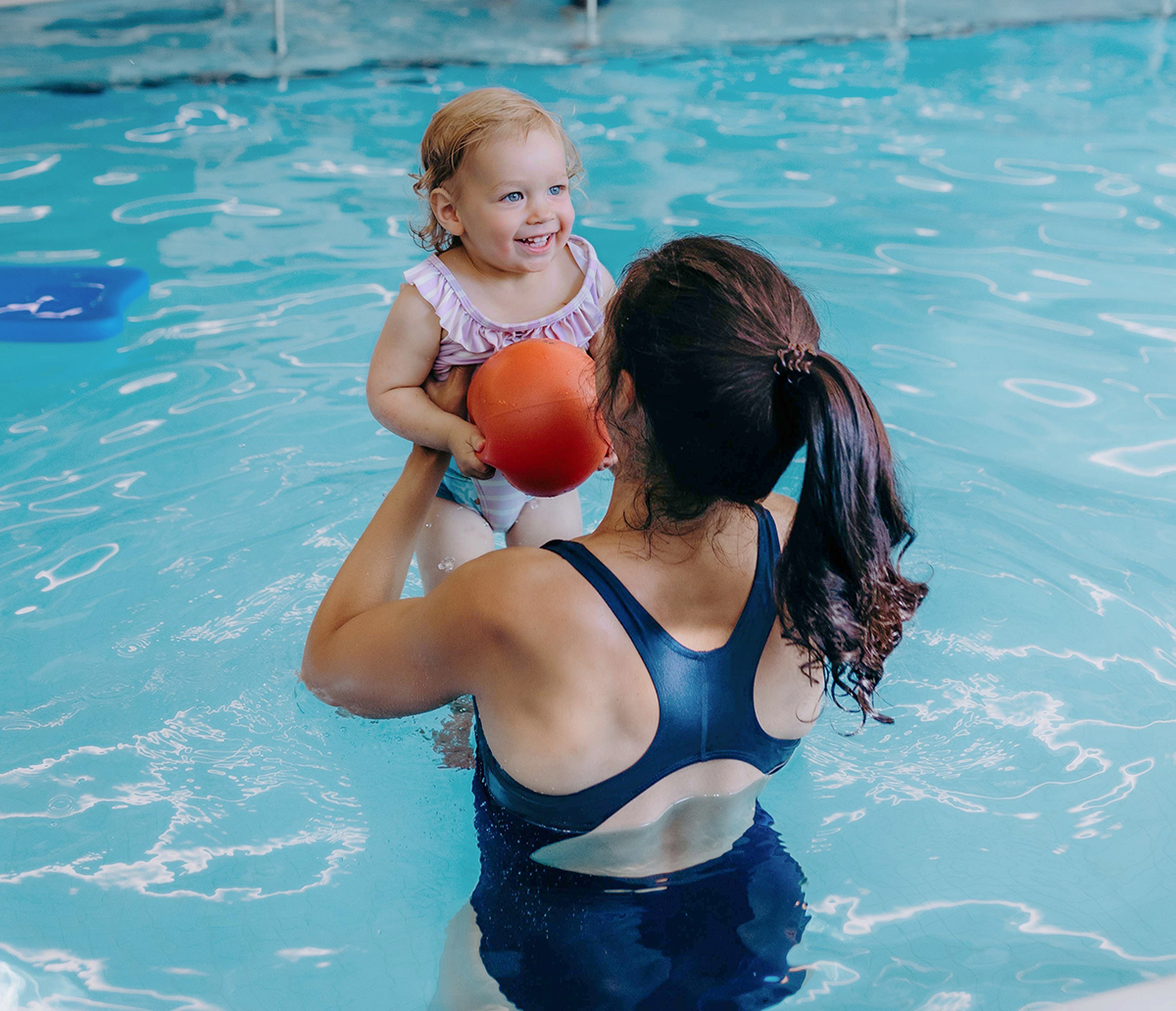 mother and child enjoy Wee Swim in Wellness Institute warm therapy pool